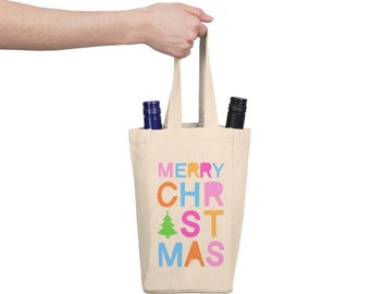May include: A beige canvas wine tote bag with two bottle slots. The bag has a handle and features the text "MERRY CHRISTMAS" in colorful letters with a green Christmas tree graphic.