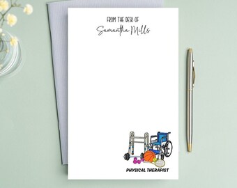 May include: White notepad with the text "From the desk of Samantha Mills" at the top. The bottom of the notepad has a drawing of a wheelchair, walker, dumbbells, tennis racket, and basketball. The text "Physical Therapist" is below the drawing.