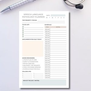 May include: A white Speech Language Pathology Planner with a schedule, to-do list, and admin reminders. A silver pen and a stethoscope are in the background. The planner includes sections for documentation and follow-ups.