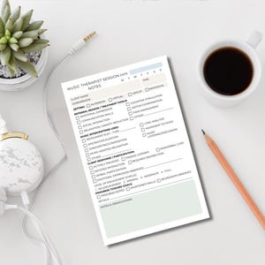 May include: A music therapist session notes sheet with checkboxes, a pencil, a cup of coffee, a succulent plant, and headphones. The sheet includes sections for client information, treatment goals, and music interventions used. The text "MUSIC THERAPIST SESSION DATE NOTES" is visible.