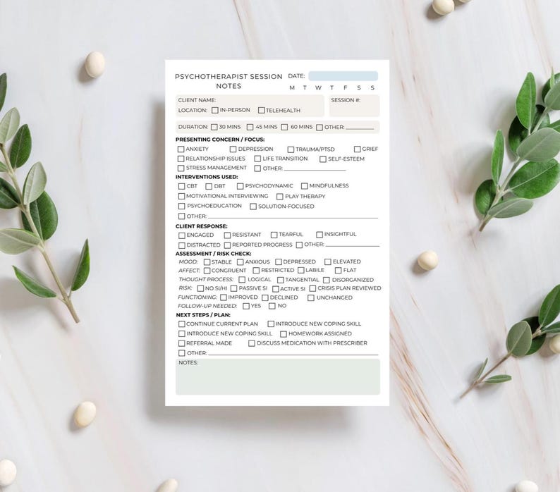 May include: A white Psychotherapist Session Notes form with checkboxes for client information, presenting concerns, interventions, client response, and assessment. The form includes sections for duration, next steps, and notes. Green leaves and white decorative objects are in the background.