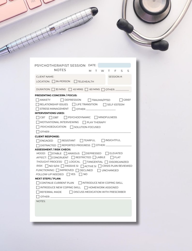 May include: A white notepad with a detailed form for a psychotherapist session, including sections for client information, presenting concerns, interventions, and next steps. A pen and stethoscope are in the background.