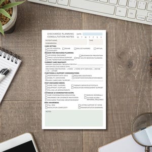 May include: A white Discharge Planning Consultation Notes form with checkboxes and sections for patient information, care setting, and post-discharge needs. The form is on a wooden desk with a keyboard and a magnifying glass.