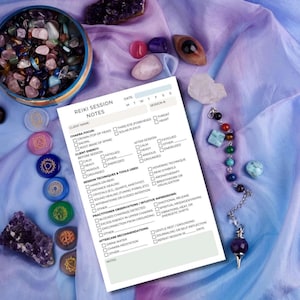 May include: A Reiki session notes sheet with a variety of crystals, a bowl of stones, and a pendulum. The sheet includes sections for client information, chakra focus, energy levels, techniques, and aftercare recommendations. The background is a soft, purple fabric.