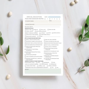 May include: A white Special Education Teacher Session Notes sheet with a light green border. The form includes sections for student information, session details, activities, and observations. The text is in black.
