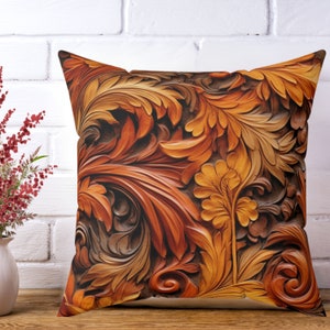May include: A decorative throw pillow with a brown and orange floral pattern. The pattern is carved into the fabric, giving it a 3D effect.