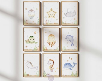 May include: Set of eight watercolor illustrations featuring various sea creatures, including a starfish, jellyfish, octopus, turtle, dolphin, stingray, narwhal, and whale. Each illustration is framed with a light brown border.