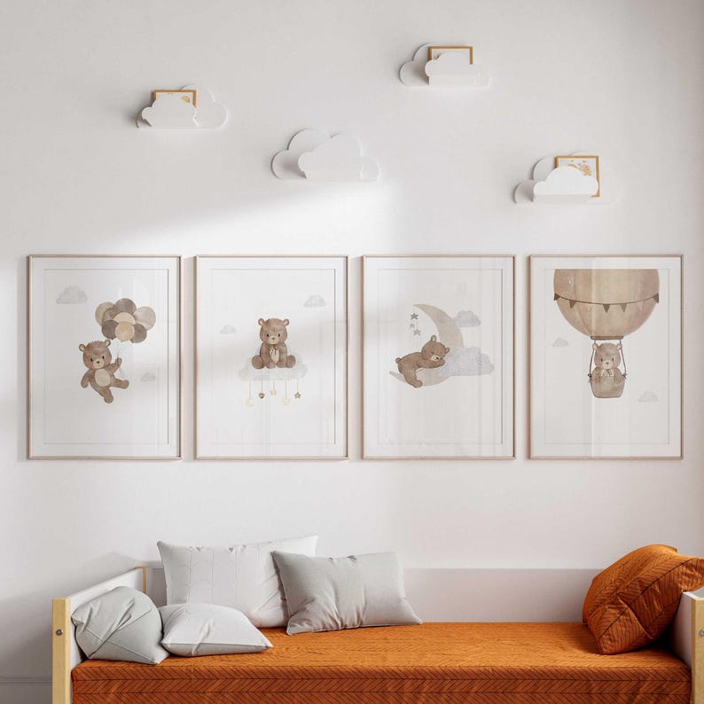 May include: Three framed prints with watercolor illustrations of bears in different settings. The first print shows a bear holding balloons, the second shows a bear sitting on a cloud, and the third shows a bear sleeping on a crescent moon.