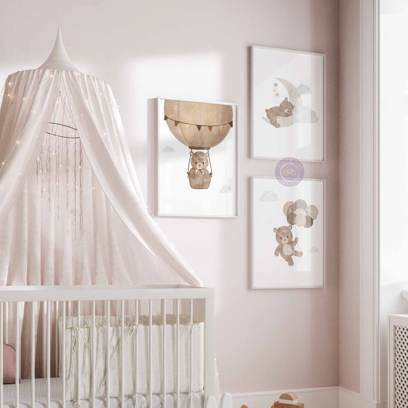 May include: Three framed prints featuring a brown bear in different scenes. The first print shows the bear in a hot air balloon, the second shows the bear sleeping on a crescent moon, and the third shows the bear holding balloons.