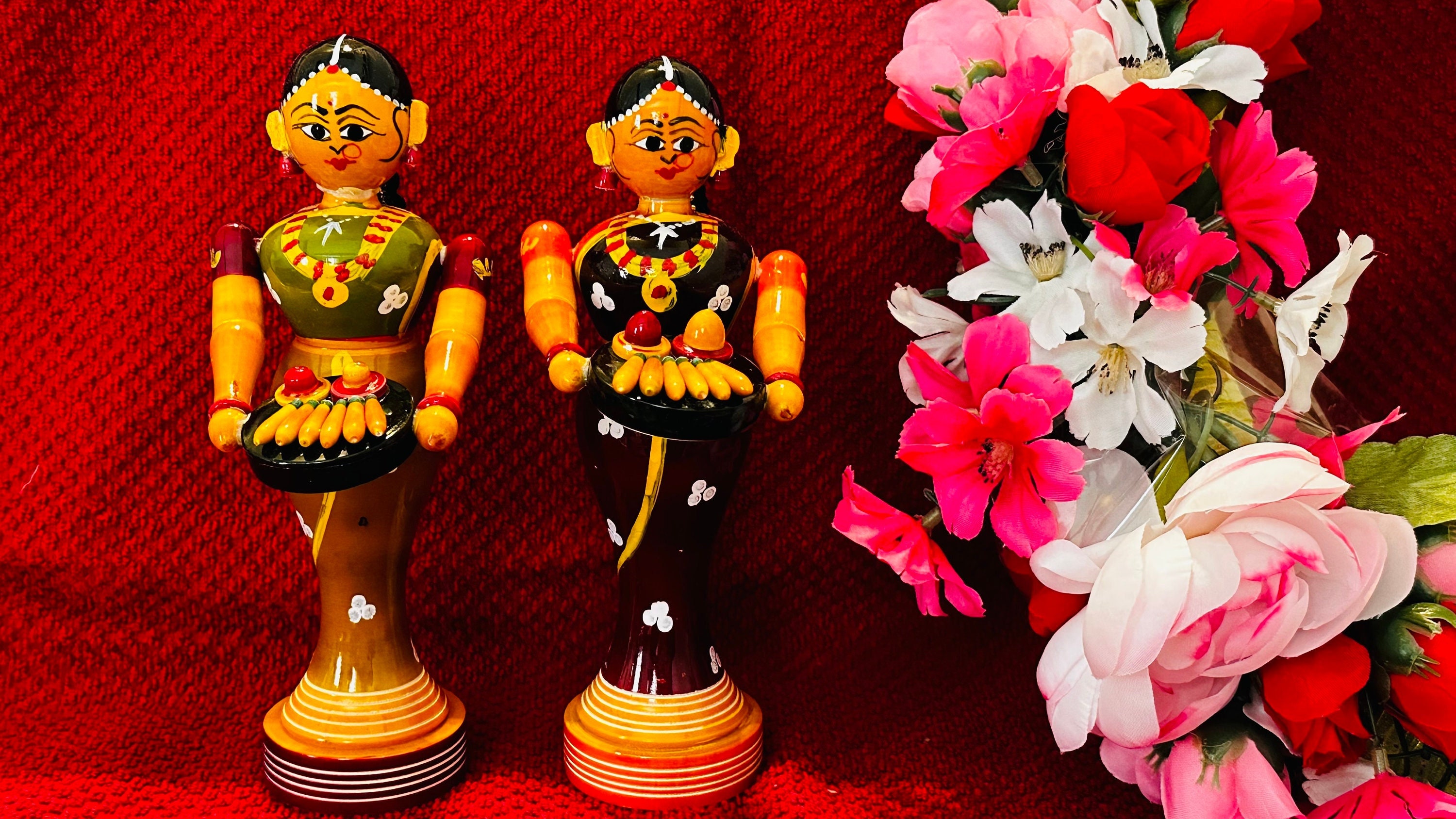 Traditional girls offering taamboolam for welcoming | etikoppaka