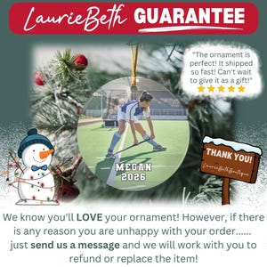 May include: A circular ornament featuring a photograph of a field hockey player on a green turf field. The text MEGAN and 2026 is printed on the ornament. A cartoon snowman with a blue hat and a wooden sign reading THANK YOU are also visible.