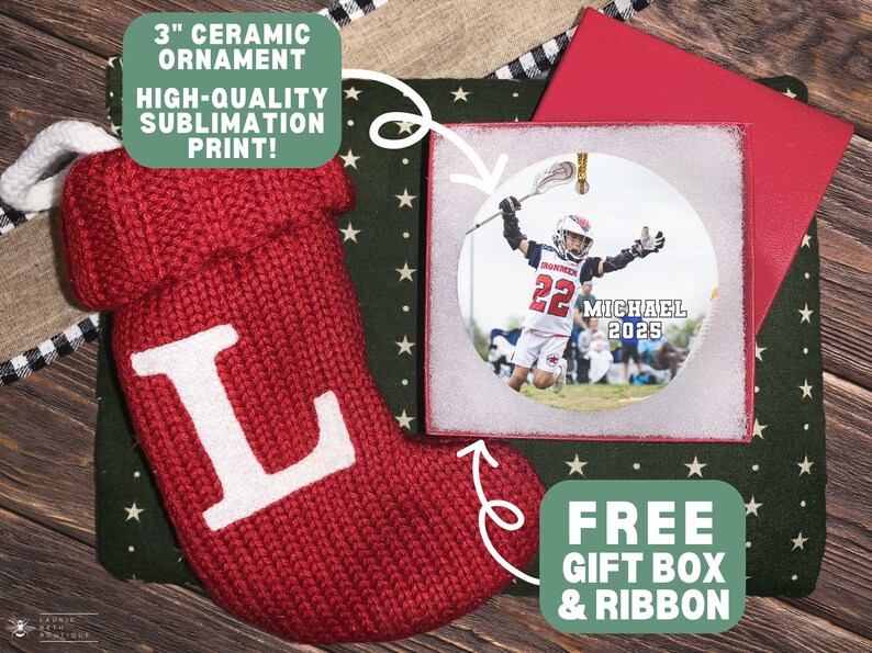 May include: A red knit Christmas stocking with a white letter "L" next to a 3-inch ceramic ornament with a lacrosse player image. The ornament is in a gift box with a red lid. The text says "3" ceramic ornament, high-quality sublimation print!" and "Free gift box & ribbon."