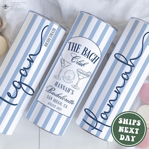 May include: Three white and blue striped tumblers with custom text for a bachelorette party. One says "Megan" and "Bridesmaid", another says "The Bach Club" with "Hannah's Bachelorette San Diego, CA August 2025", and the last says "Hannah" and "Bride".