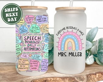 May include: A frosted glass tumbler with a bamboo lid and straw. The tumbler features a rainbow design with the text "Everyone Deserves a Voice" and "Mrs. Miller".
