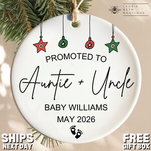 May include: White ceramic Christmas ornament with the text "PROMOTED TO Auntie + Uncle" in black script. The ornament has red and green star and ball decorations. The baby's last name and due date are also printed on the ornament.