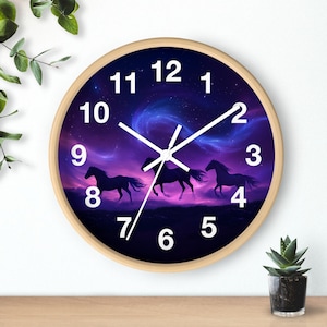 May include: A round wooden wall clock with a purple and blue starry sky background. Three black silhouettes of horses are running across the sky. The clock face has white numbers and hands.
