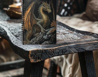 May include: A spiral bound notebook with a black cover featuring a detailed illustration of a golden dragon with green scales and wings. The dragon is perched on a rocky ledge in a dark forest setting.