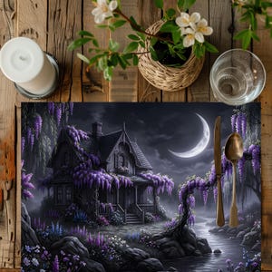May include: A placemat featuring a gothic-style house with purple wisteria vines, a crescent moon, and a river scene. A gold-colored knife and spoon are placed on the right side. The scene is set at night with a dark, moody atmosphere.