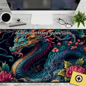 May include: A colorful, detailed illustration of a blue dragon with gold accents, surrounded by vibrant flowers and foliage. The text "Available in Many Styles/Sizes" is displayed at the top of the image.