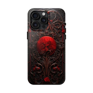 May include: A black phone case with a red and black design. The design features a large red circle with intricate black floral patterns around it.