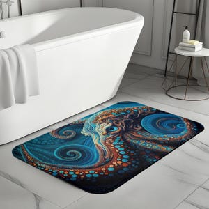 May include: A blue, brown, and orange bath mat with an abstract octopus design. The octopus has swirling tentacles and a textured, patterned body.