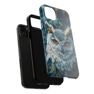 May include: A black phone case with a colorful owl design. The owl has blue, green, and white feathers and a yellow beak. The case is made of a hard plastic material and has a clear back.