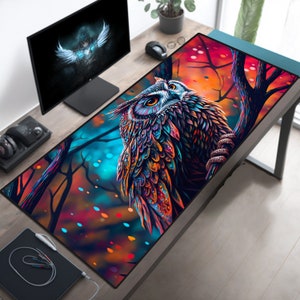 May include: A colorful owl with intricate patterns on its feathers is perched on a branch in a forest setting. The background features a vibrant mix of red, orange, blue, and green hues, creating a surreal and artistic aesthetic.
