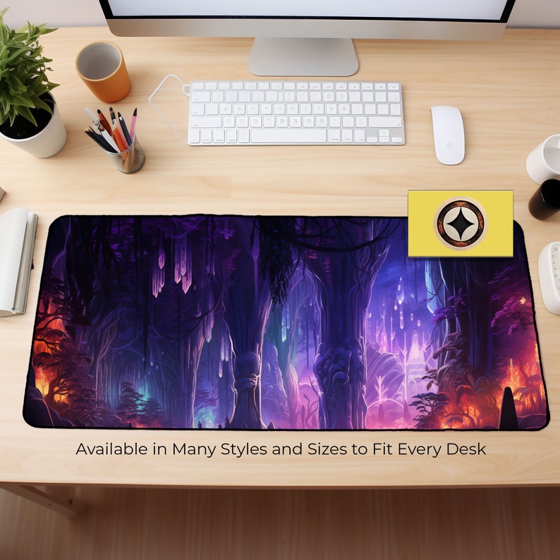 May include: A purple and blue fantasy landscape with glowing crystals and trees. The image is on a black and white desk mat with the text "Available in Many Styles and Sizes to Fit Every Desk".