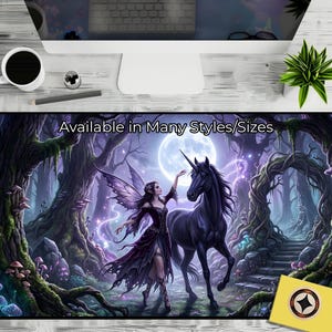 May include: A desk mat with a fantasy scene of a fairy and a black unicorn in a moonlit forest. The mat is predominantly purple and black, with the text "Available in Many Styles/Sizes" displayed at the top.