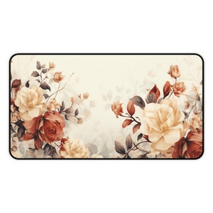 May include: A floral design mousepad with a white background and a border. The design features a variety of flowers in shades of red, pink, and yellow.