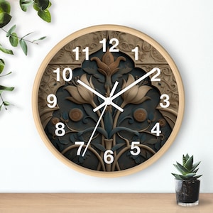 May include: Round wall clock with a light wood frame. The clock face features a dark teal background with a floral design in shades of beige, brown, and teal. White numerals and clock hands complete the design.
