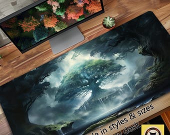 Pode incluir: Um tapete de secretária grande com um design de paisagem de fantasia. A imagem mostra uma árvore brilhante num cenário florestal com cascatas. O texto "Available in styles & sizes to fit any desk" é visível.