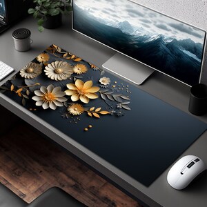 May include: A black and gold floral design mousepad with a dark gray background. The flowers are 3D and have a paper-like texture.