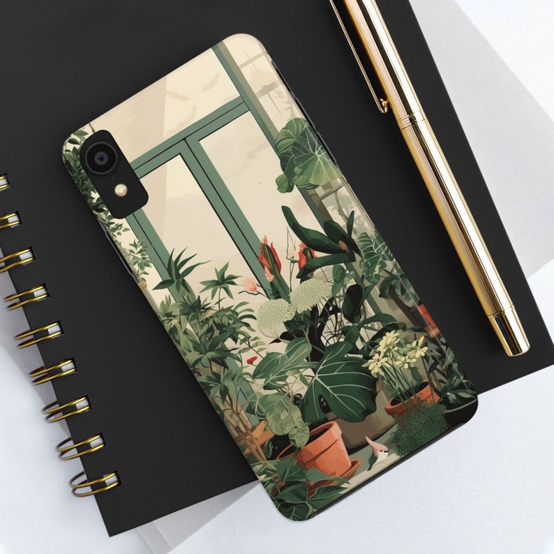 May include: A phone case featuring a colourful illustration of plants in a greenhouse setting. The case depicts a variety of green plants, red flowers, and a window with a view of the outdoors.