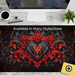 Puede incluir: Un diseño floral negro y rojo con un gran corazón negro en el centro. El corazón tiene detalles intrincados y un diseño estilizado en su interior. El texto "Available in Many Styles/Sizes" está en la parte superior de la imagen.