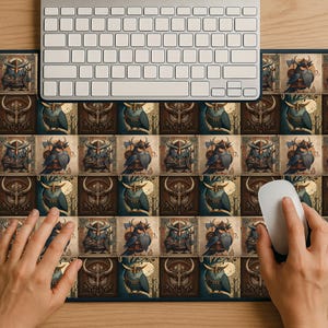 May include: A rectangular mouse pad with a dark blue border featuring a repeating pattern of owl and shield illustrations in shades of brown, blue, and gold. A white mouse and keyboard are on top of the pad.