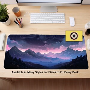 May include: A purple and blue mountain range with pink clouds and a starry night sky. The mousepad features a stylized landscape design. "Available in Many Styles and Sizes to Fit Every Desk" is printed at the bottom of the mousepad.