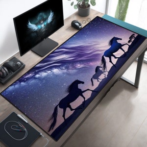 May include: A large purple and blue mouse mat with a starry sky design and three black silhouettes of horses running across the surface.