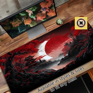 May include: A black and red Japanese-inspired design with a red moon, a pagoda, and trees. The design is on a black background with a white border. The text "Available in styles & sizes to fit any desk" is at the bottom of the image.