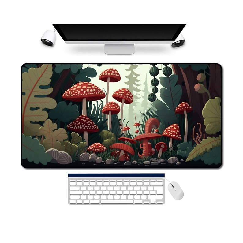 May include: A colourful mouse mat with a forest scene featuring red and white mushrooms, green leaves, and a brown tree trunk.