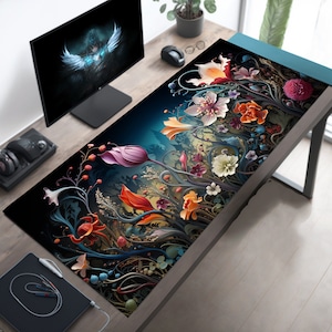 May include: A black and dark blue mousepad with a floral design featuring colorful flowers and vines. The flowers are in shades of pink, red, orange, yellow, and white.