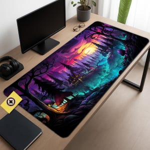 May include: A rectangular desk mat featuring a vibrant fantasy landscape. The design showcases a castle, trees, and a colorful sky with shades of purple, orange, and teal. The mat is placed on a wooden desk, with a computer monitor and other office accessories.