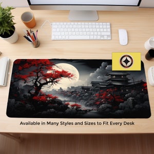 May include: A black and red mousepad with a Japanese-inspired design featuring a full moon, a red-leafed tree, and a traditional Japanese building. The text "Available in Many Styles and Sizes to Fit Every Desk" is at the bottom of the mousepad.