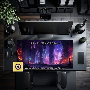 May include: A fantasy-themed desk mat with a purple, blue, and orange color scheme. The mat features a glowing forest scene with tall trees and a river. The text "Available in Many Styles/Sizes" is printed on the mat. The mat measures 15.5 inches by 31 inches.