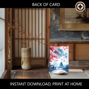 May include: Printable digital art print featuring a watercolor painting of a Japanese pagoda with cherry blossoms and red lanterns. The pagoda is surrounded by a blue pond and the background is a blue sky with white clouds.