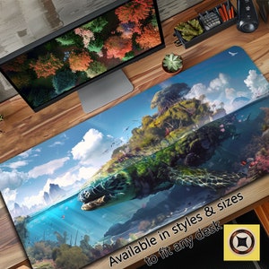 May include: A large desk mat featuring a colourful illustration of a turtle swimming through a tropical island. The turtle is partially submerged in the water, with the island above the waterline. The sky is blue with white clouds. The text "Available in styles & sizes to fit any desk" is at the bottom of the mat.