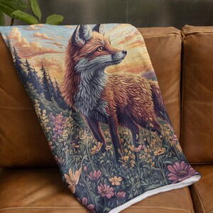 May include: A red fox stands in a field of wildflowers, looking towards a sunset. The fox is surrounded by a variety of flowers, including pink, yellow, and purple.