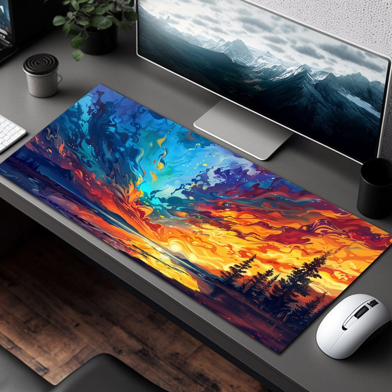 May include: A colorful abstract sunset scene with a silhouette of trees in the foreground. The design is printed on a large rectangular mouse pad.
