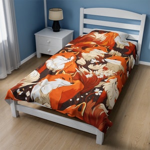 May include: A white twin-sized bed with a red, orange, and white fox print duvet cover. The duvet cover features a repeating pattern of foxes with white flowers.