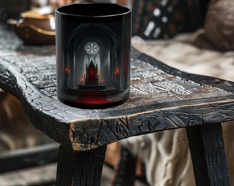 May include: Black ceramic mug with a gothic cathedral design, including a red throne, candles, and a stained-glass window. The mug is cylindrical and rests on a dark, textured wooden surface.